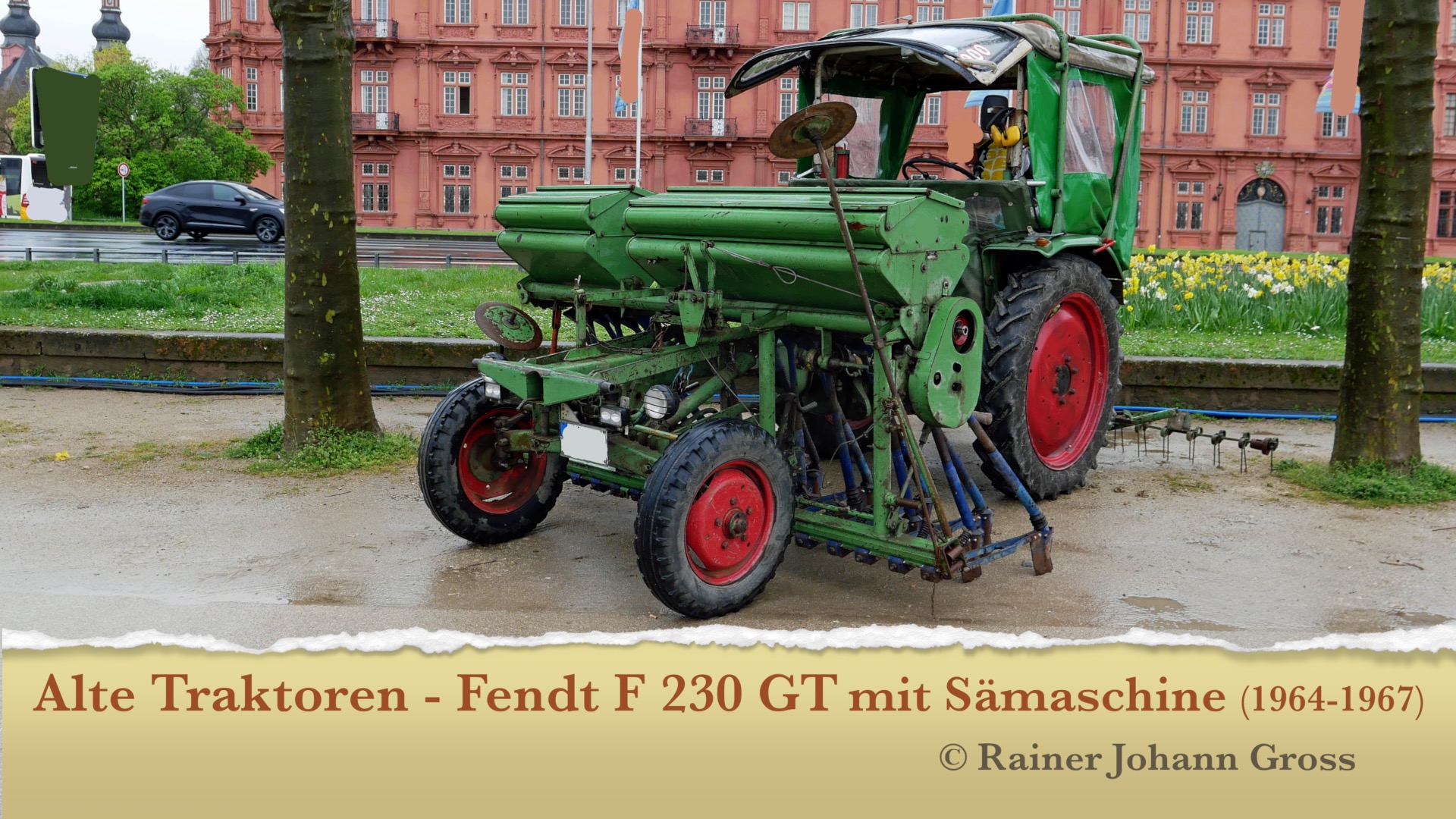 man watching a band on the stage wearing a red t-shirt and black hat.